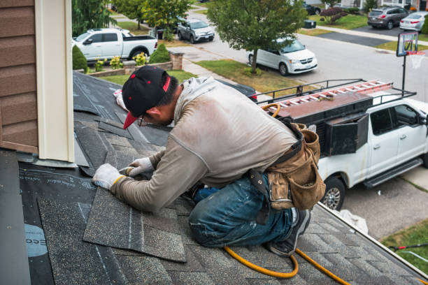 Professional Roofing technician working in Woodville, MA